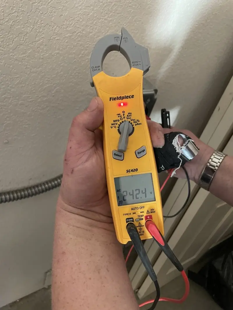 Voltage testing with clamp meter during Electrical Installation Services in Gautier